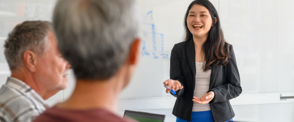 woman laughing while presenting