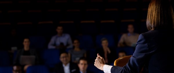 Speaker in front of an audience